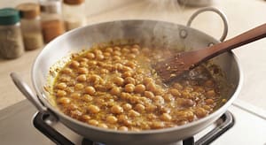 Chikar Cholay banane ke liye chanon ko crush karna taake gravy creamy ho jaye."